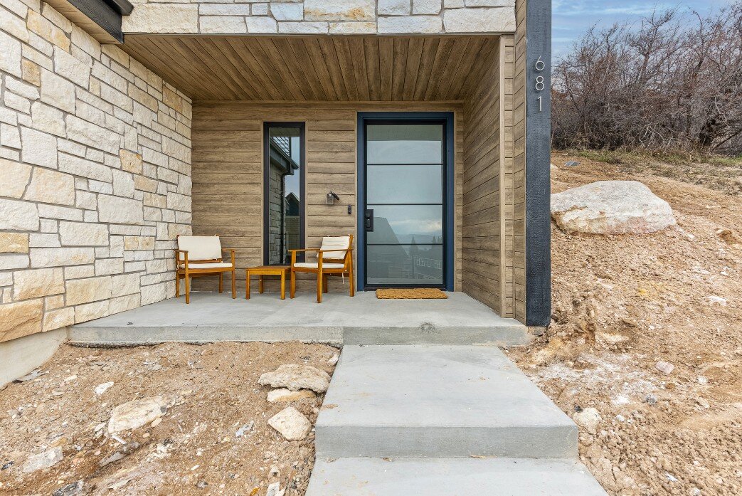 Exterior of Bear Lake Custom Home Walkway, Front Porch Next to the Front Door by 10X Builders