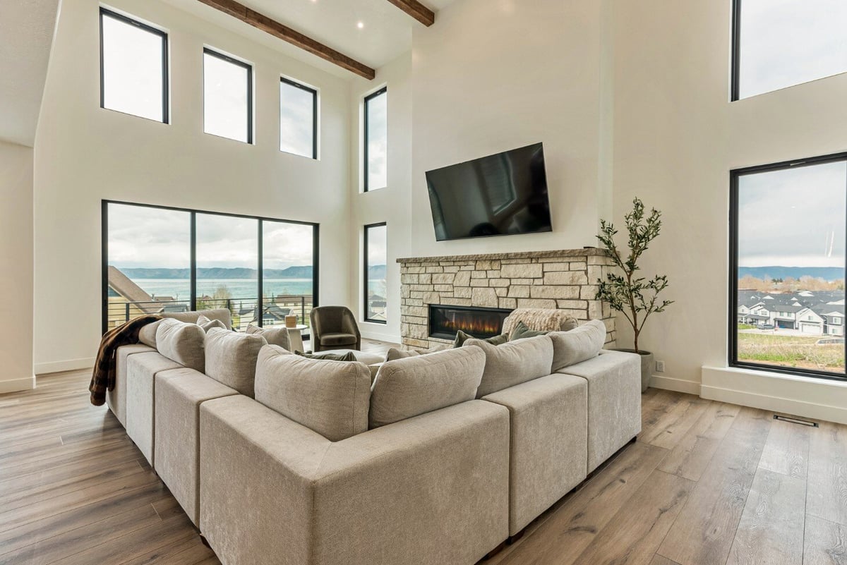 Large Gray Sectional in Front of Fireplace in Bear Lake Custom Home Living Room by 10X Builders