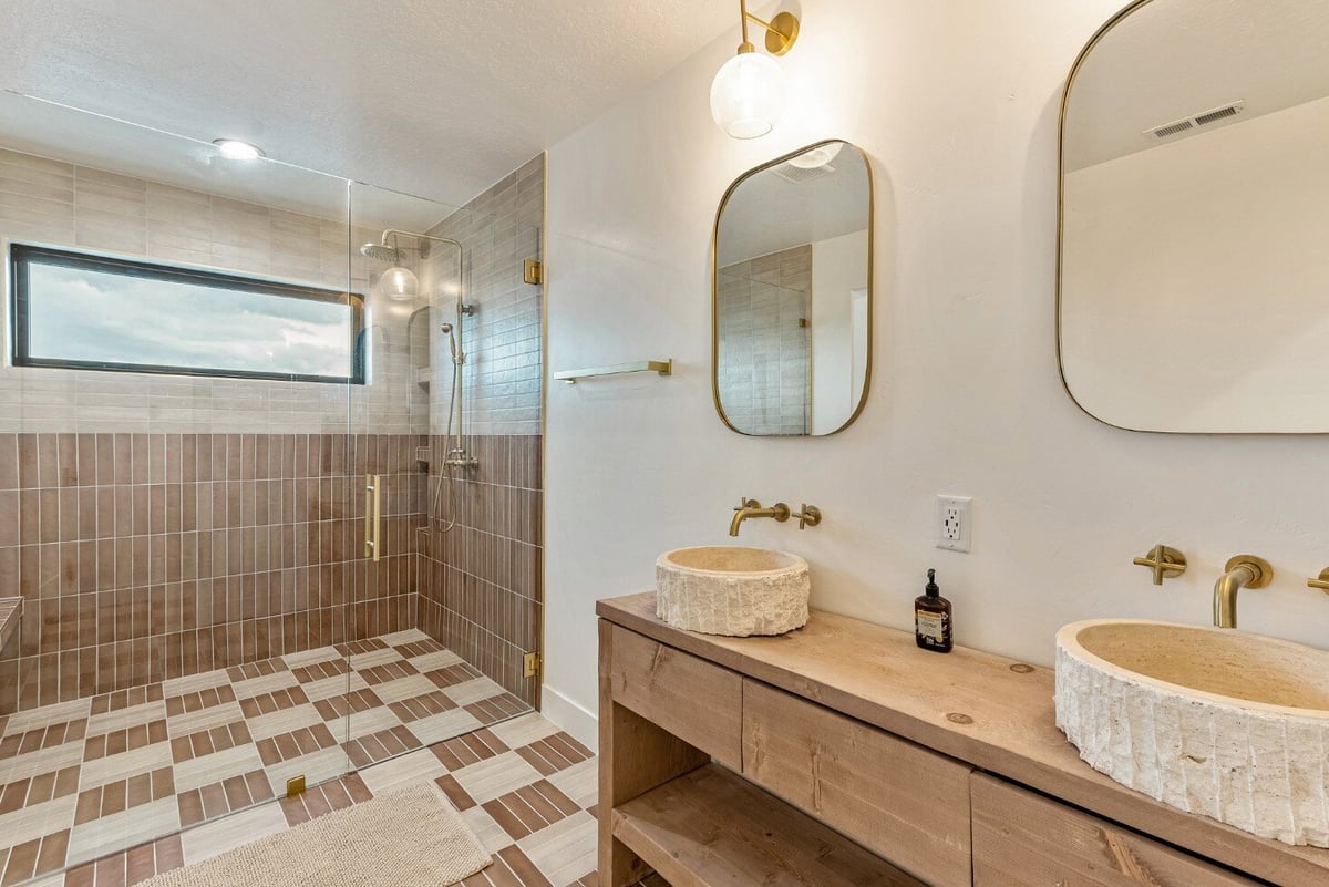 Master Bathroom with Jack and Jill Sinks, Walk-in Shower and Checkered Tile Floor in Bear Lake Custom Home by 10X Builders