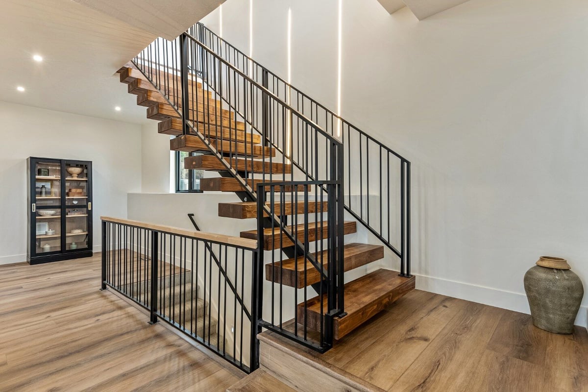 Stairwell into Main Floor in Bear Lake Custom Home by 10X Builders