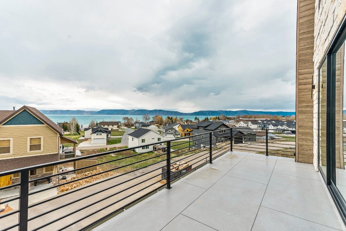 View of Neighborhood and Lake From the Living Room Balcony of Bear Lake Custom Home by 10X Builders