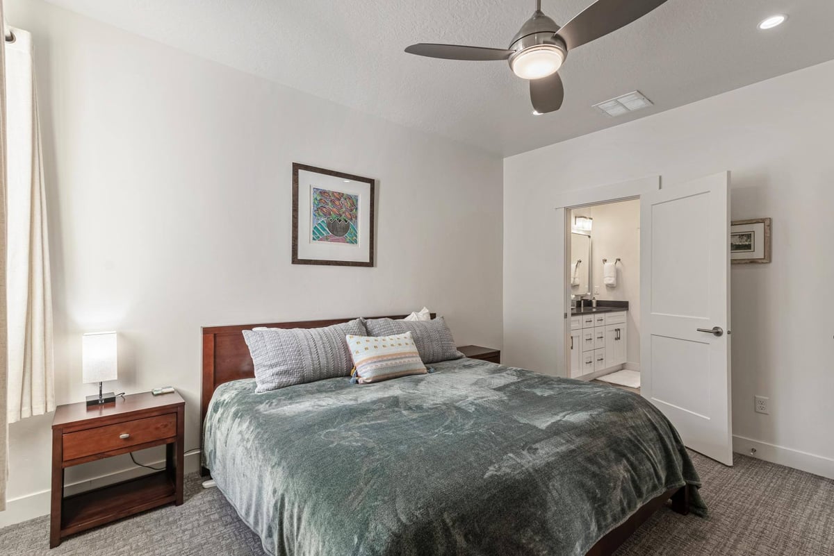 Guest Bedroom Bed, Nightstand and Bathroom in Remodeled Utah Home