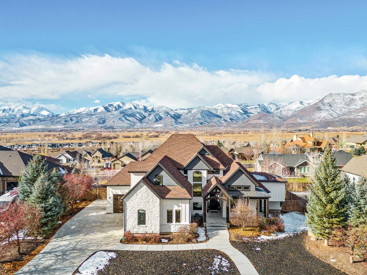 High Aerial View of Remodeled Utah Home Exterior with Mountain Landscape