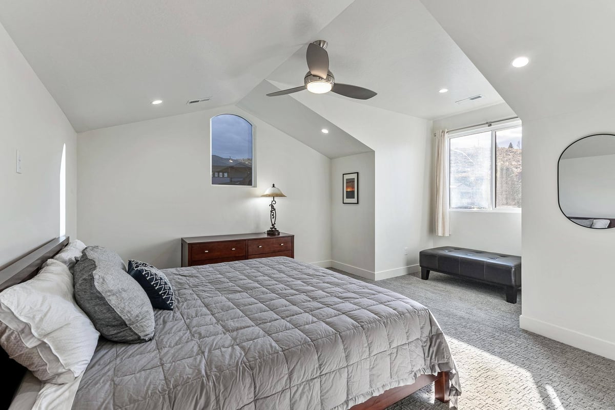 Spare Bedroom with Ceiling Fan and Window in Remodeled Utah Home